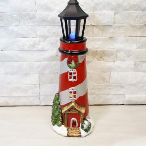 Bomboniera faro Babbo Natale realizzata in ceramica con luci led. 