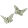 Farfalla magnete realizzata in porcellana con decoro tortora o rosa assortiti in due forme.