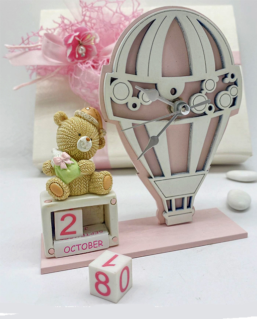 Orologio mongolfiera orsetto rosa con calendario perpetuo è un'idea particolare e dal design unico.