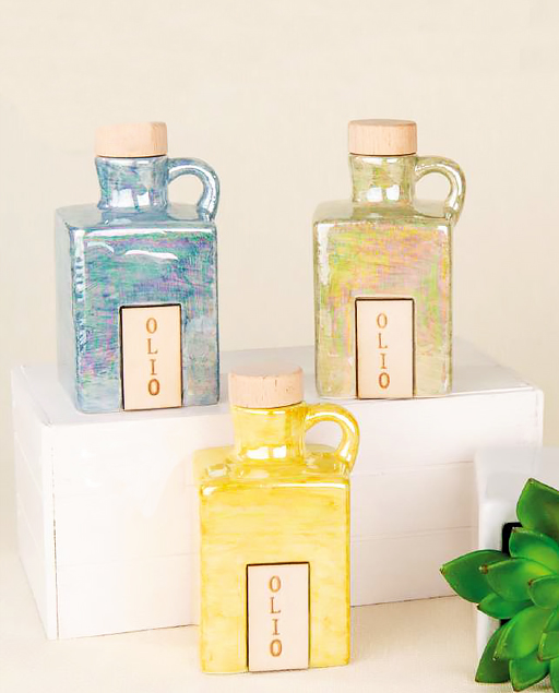 Bottiglietta oliera cubo realizzata in porcellana con finitura cangiante, ha un design squadrato contemporaneo