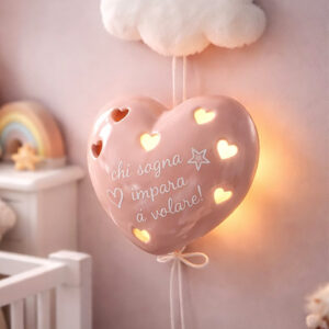 Lampada led cuore a forma di palloncino rosa con la frase “Chi sogna impara a volare”